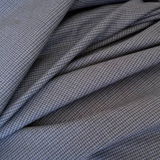 Refined suiting fabric in an elegant blue-grey micro check pattern.