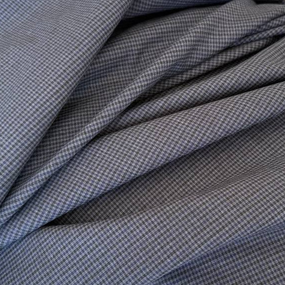 Refined suiting fabric in an elegant blue-grey micro check pattern.