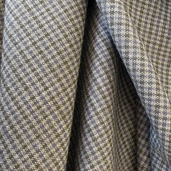 Refined suiting fabric in an elegant light blue-grey micro check pattern.