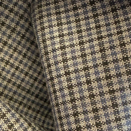 Refined suiting fabric in an elegant light blue-grey micro check pattern.