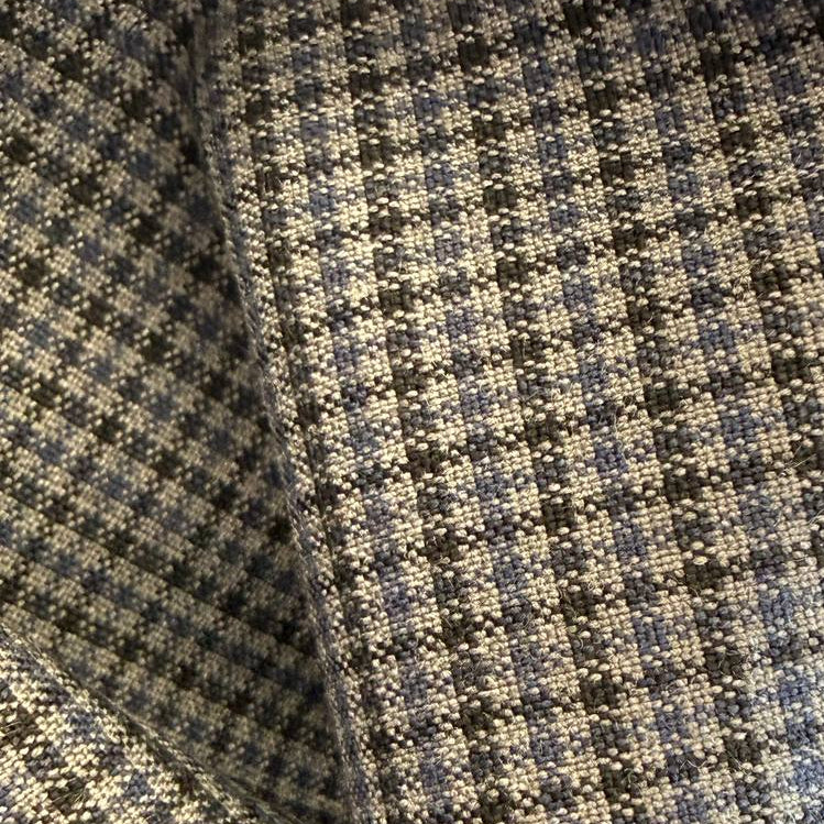 Refined suiting fabric in an elegant light blue-grey micro check pattern.