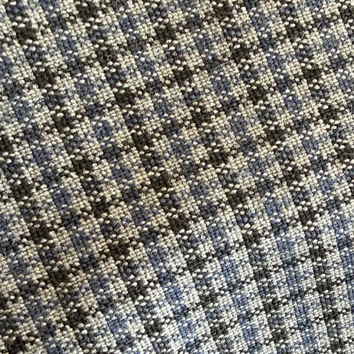 Refined suiting fabric in an elegant light blue-grey micro check pattern.