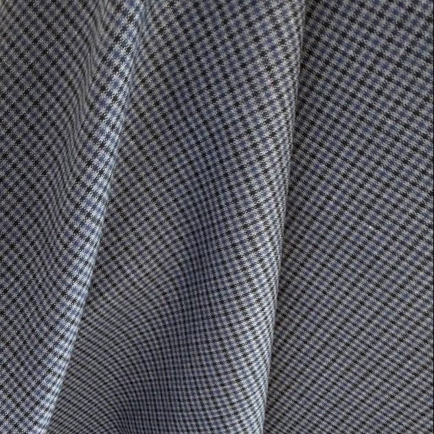 Refined suiting fabric in an elegant light blue-grey micro check pattern.