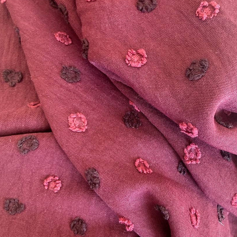 Elegant fancy cotton jacquard fabric in a rich burgundy shade.
