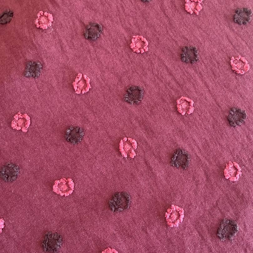 Elegant fancy cotton jacquard fabric in a rich burgundy shade.
