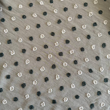 Elegant fancy cotton jacquard fabric in a sophisticated taupe shade featuring a subtle woven dot pattern.
