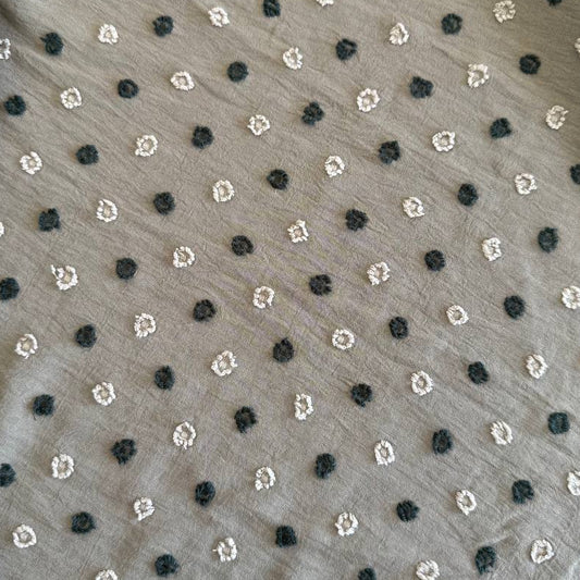 Elegant fancy cotton jacquard fabric in a sophisticated taupe shade featuring a subtle woven dot pattern.