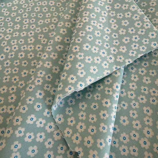 light blue fabric with small white daisy floral pattern for sewing and quilting – Sasha’s Atelier Canada