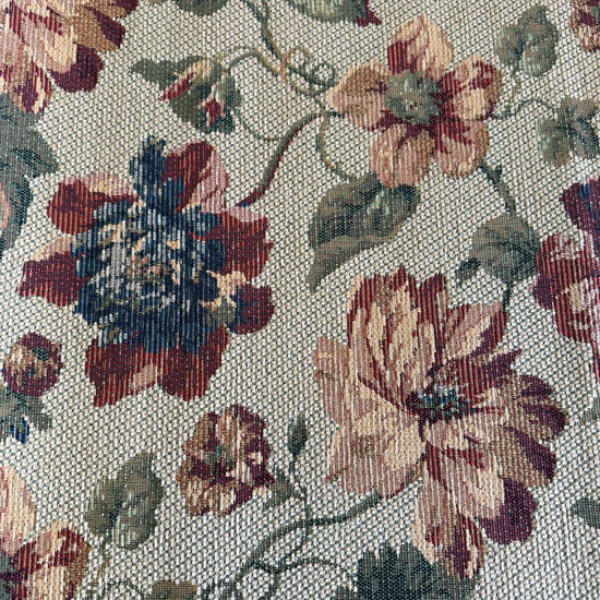 ecorative jacquard upholstery fabric with a rich woven floral pattern and textured surface.