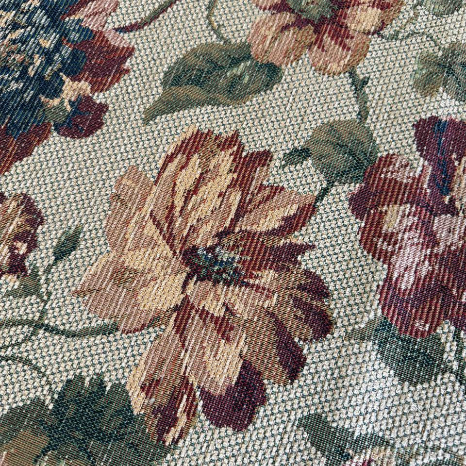 decorative jacquard upholstery fabric with a rich woven floral pattern and textured surface.