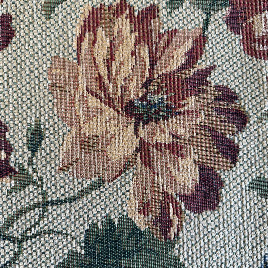 decorative jacquard upholstery fabric with a rich woven floral pattern and textured surface.