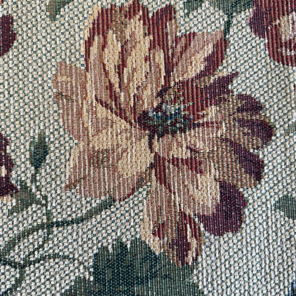 decorative jacquard upholstery fabric with a rich woven floral pattern and textured surface.