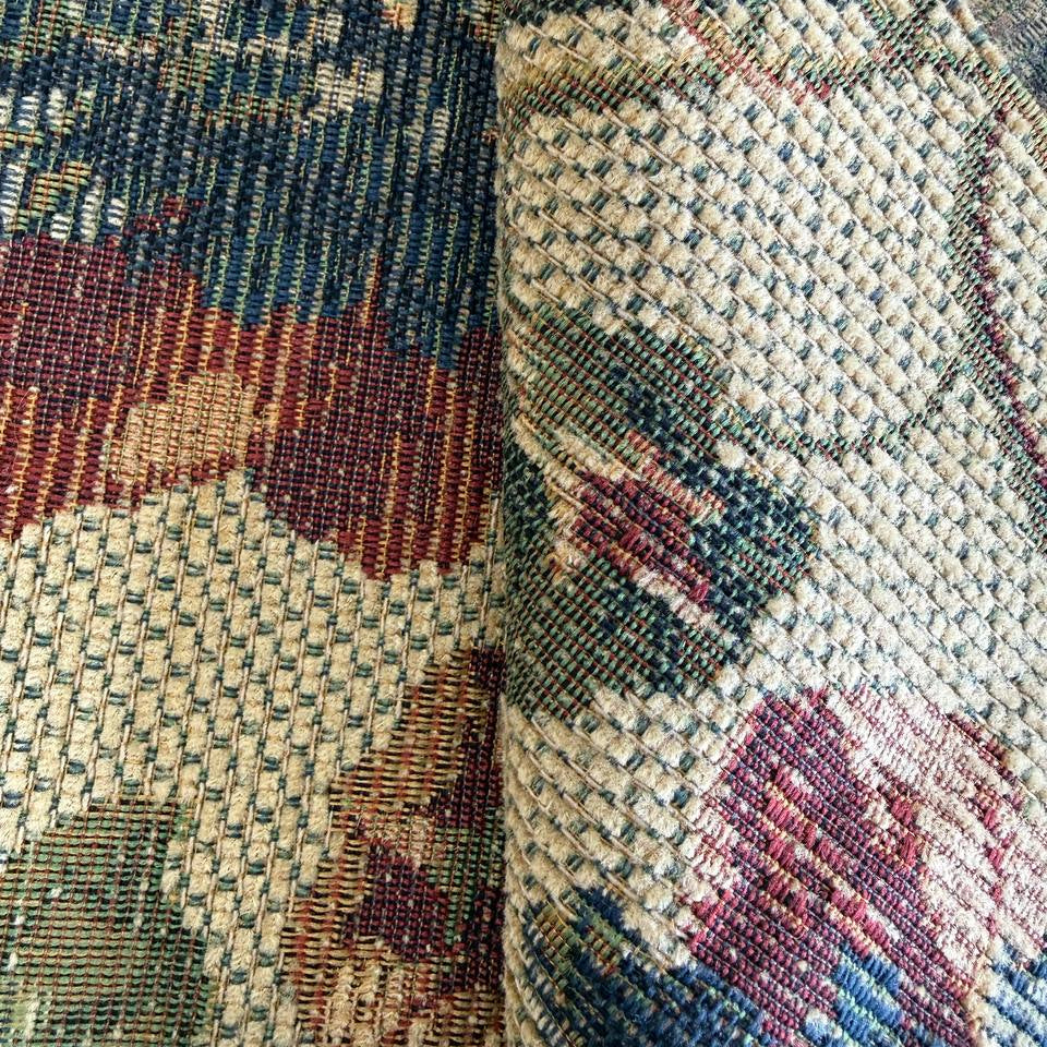 decorative jacquard upholstery fabric with a rich woven floral pattern and textured surface.