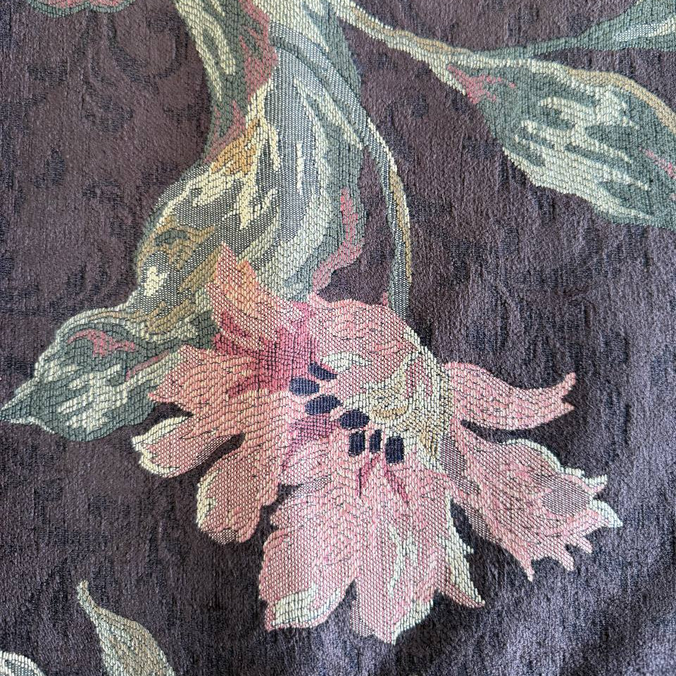 Heavy decorative tapestry fabric with a rich floral pattern in warm autumn tones.