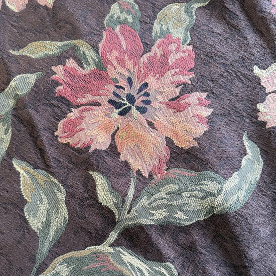Heavy decorative tapestry fabric with a rich floral pattern in warm autumn tones.