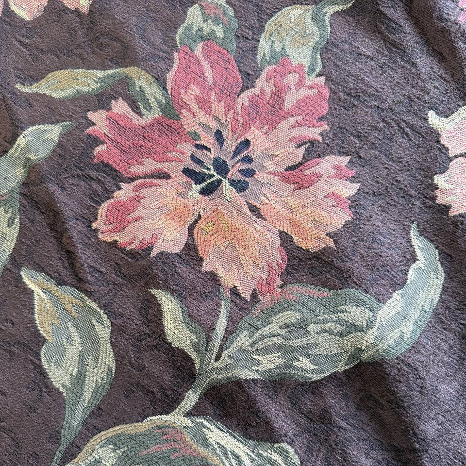 Heavy decorative tapestry fabric with a rich floral pattern in warm autumn tones.