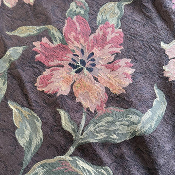 Heavy decorative tapestry fabric with a rich floral pattern in warm autumn tones.