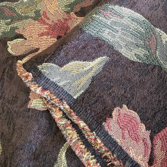 Heavy decorative tapestry fabric with a rich floral pattern in warm autumn tones.