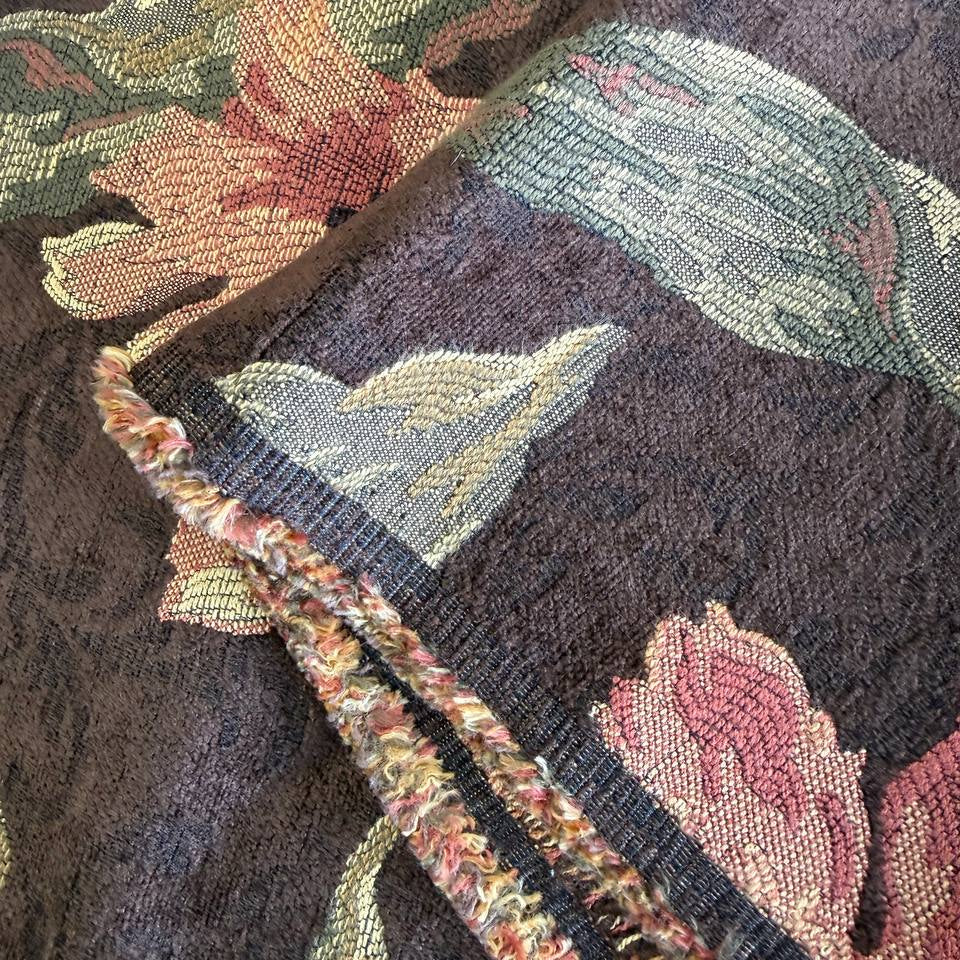 Heavy decorative tapestry fabric with a rich floral pattern in warm autumn tones.