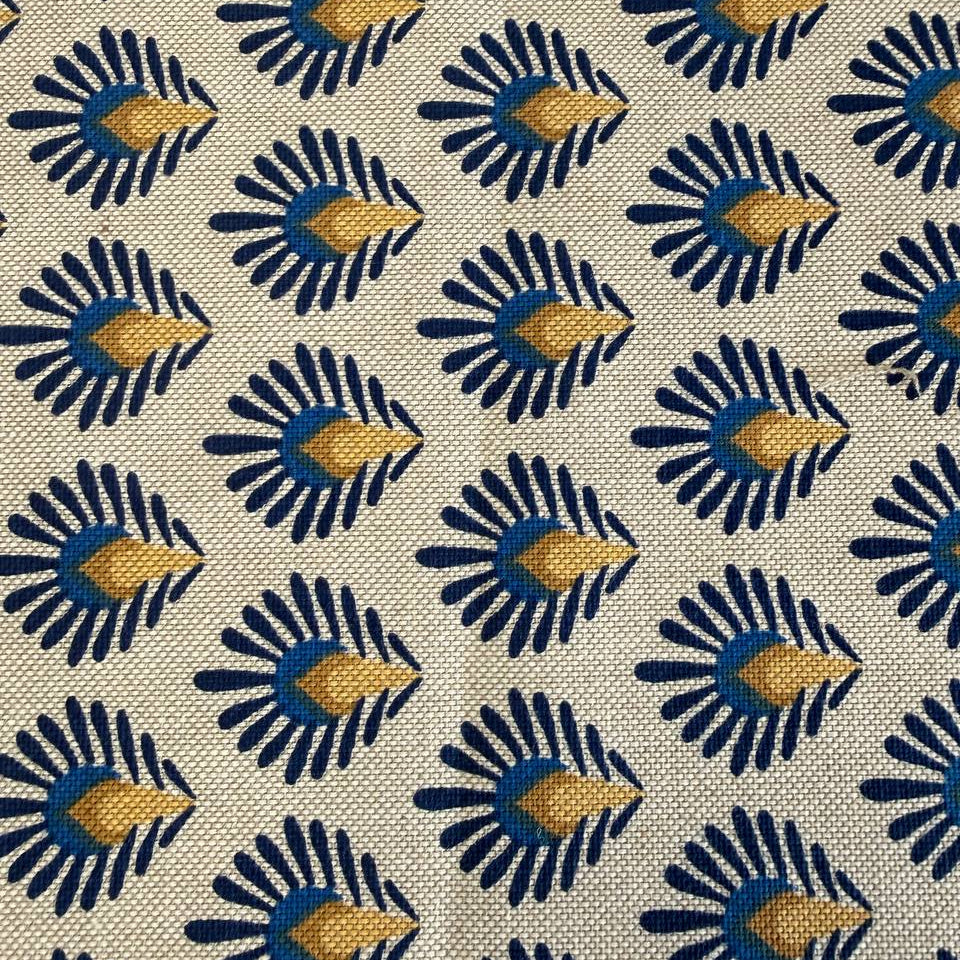 Beautiful 100% cotton home décor fabric with a structured weave and decorative botanical pattern in deep blue and warm mustard tones on a natural background.