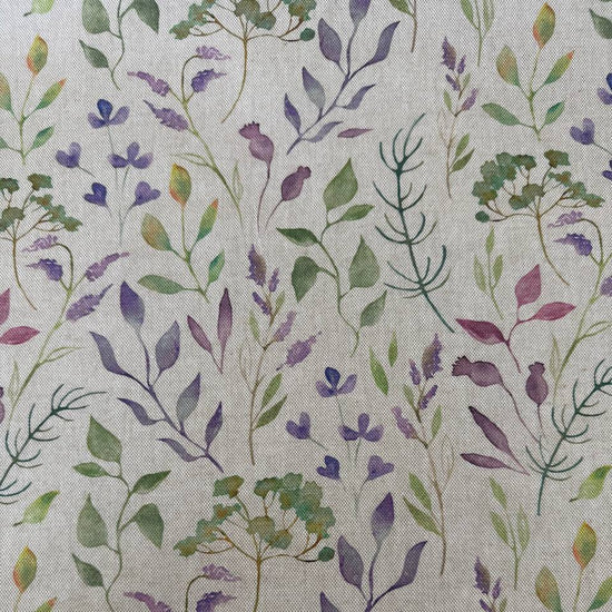 Decorative home décor fabric featuring a soft floral print in purple and green tones on a natural base.