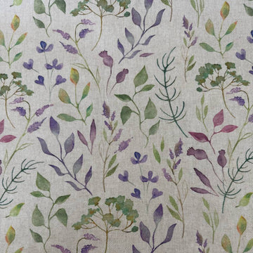 Decorative home décor fabric featuring a soft floral print in purple and green tones on a natural base.