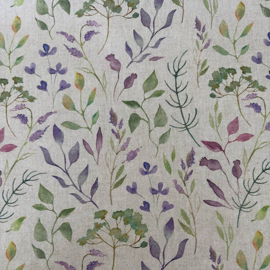 Decorative home décor fabric featuring a soft floral print in purple and green tones on a natural base.