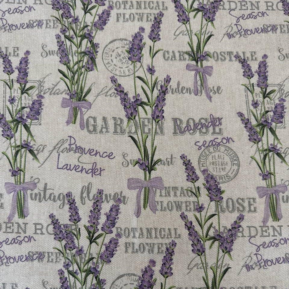 Elegant home décor fabric featuring a delicate lavender botanical print on a natural textured base.