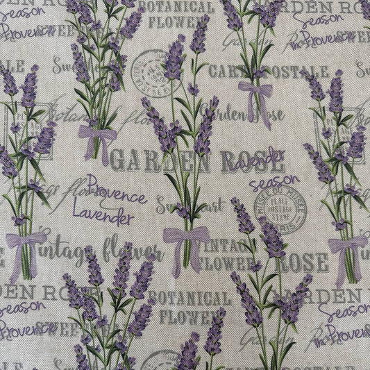 Elegant home décor fabric featuring a delicate lavender botanical print on a natural textured base.