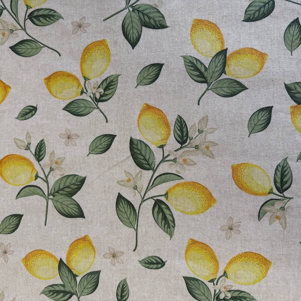 Elegant home décor fabric featuring a fresh botanical lemon print on a soft ivory background. 
