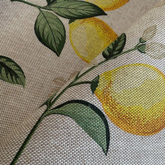 Elegant home décor fabric featuring a fresh botanical lemon print on a soft ivory background. 