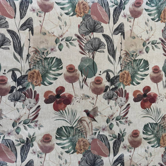 Elegant home décor fabric featuring a beautiful tropical botanical print with leaves, florals, and natural plant elements