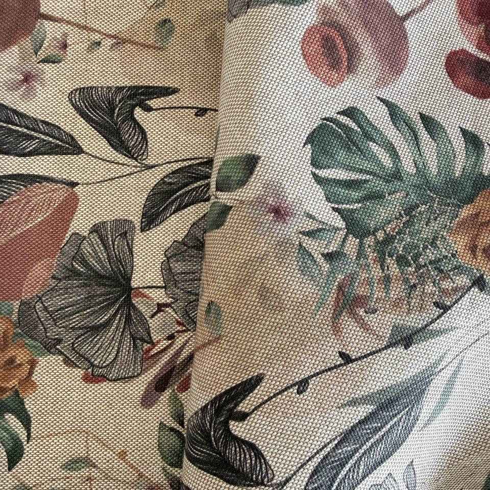Elegant home décor fabric featuring a beautiful tropical botanical print with leaves, florals, and natural plant elements
