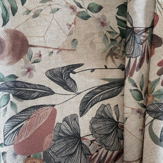 Elegant home décor fabric featuring a beautiful tropical botanical print with leaves, florals, and natural plant elements