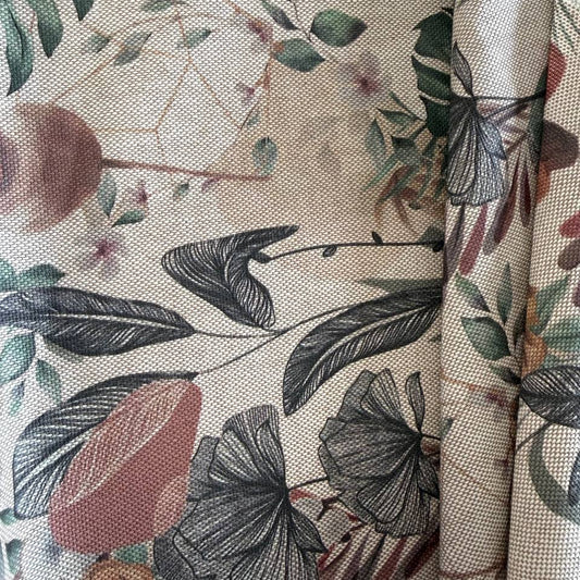 Elegant home décor fabric featuring a beautiful tropical botanical print with leaves, florals, and natural plant elements