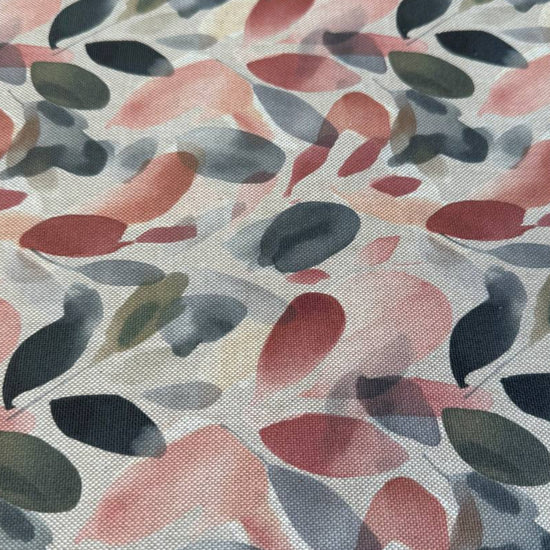 Modern home décor fabric featuring an abstract leaf pattern in soft earthy tones. 