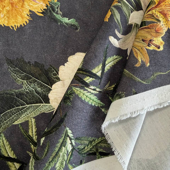 Elegant home décor fabric featuring a dramatic botanical floral print on a deep charcoal background