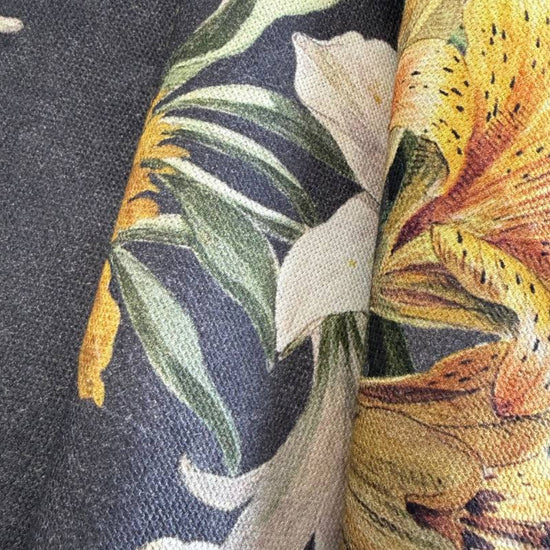 Elegant home décor fabric featuring a dramatic botanical floral print on a deep charcoal background