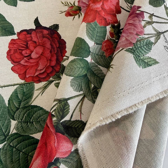 Elegant cotton fabric featuring a beautiful vintage botanical rose print on a soft ivory background.