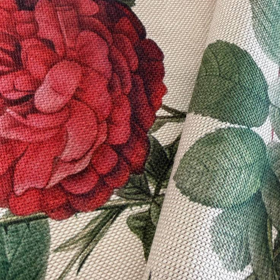 Elegant cotton fabric featuring a beautiful vintage botanical rose print on a soft ivory background.
