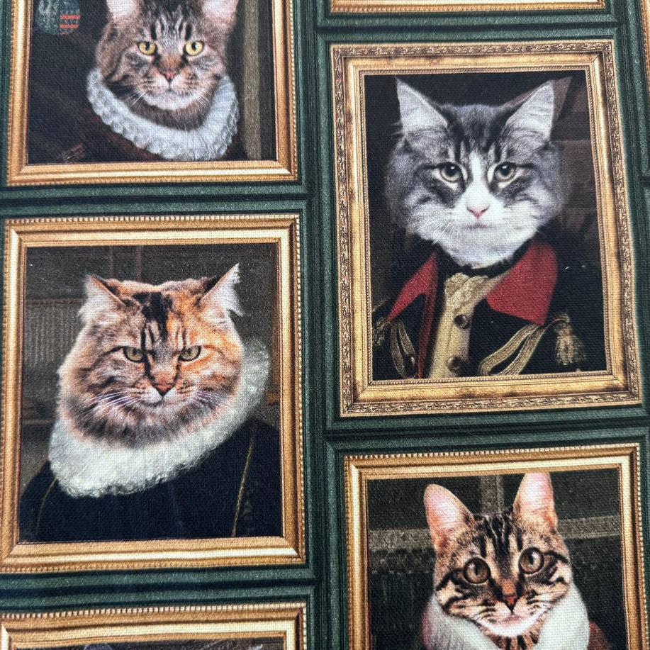 Unique and artistic cotton fabric featuring vintage-style cat portraits displayed in elegant gallery frames.