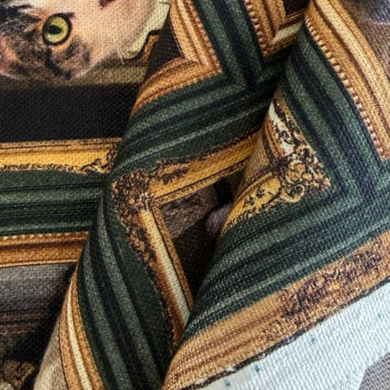 Unique and artistic cotton fabric featuring vintage-style cat portraits displayed in elegant gallery frames.