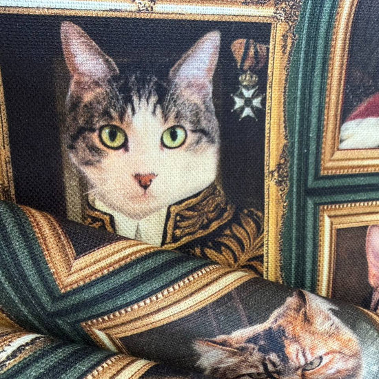 Unique and artistic cotton fabric featuring vintage-style cat portraits displayed in elegant gallery frames.