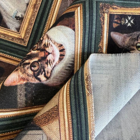 Unique and artistic cotton fabric featuring vintage-style cat portraits displayed in elegant gallery frames.