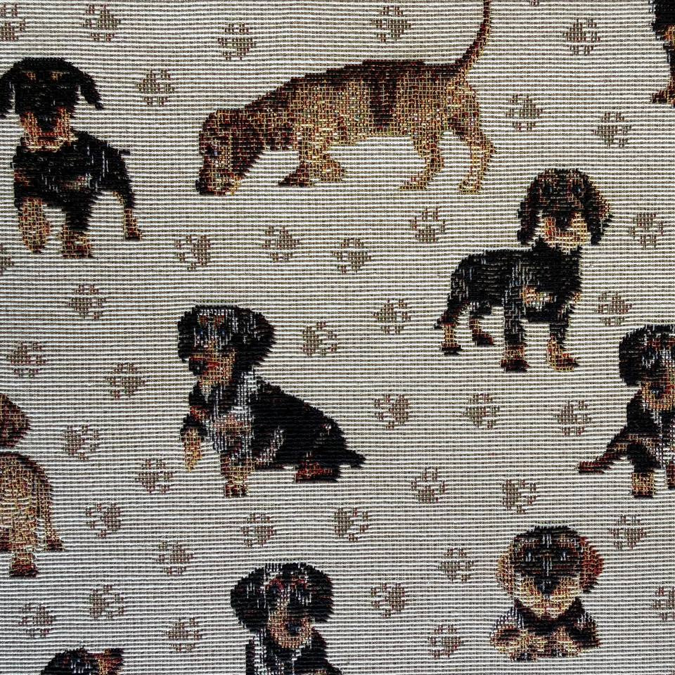 Decorative tapestry upholstery fabric featuring charming dog motifs on a soft beige background.