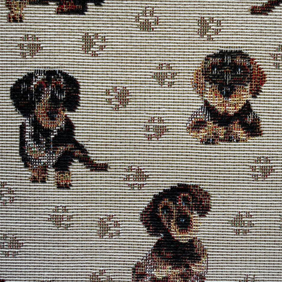 Decorative tapestry upholstery fabric featuring charming dog motifs on a soft beige background.