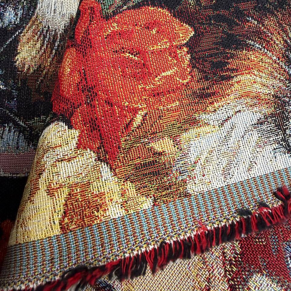 Beautiful tapestry home décor fabric featuring playful cats surrounded by vibrant orange and cream flowers on a dark background.