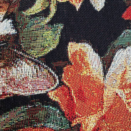 Beautiful tapestry home décor fabric featuring playful cats surrounded by vibrant orange and cream flowers on a dark background.