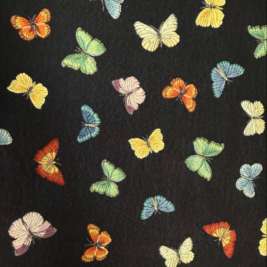 Colorful butterfly tapestry upholstery fabric on black background – Sasha’s Atelier Canada