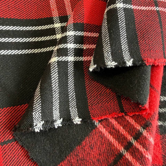 Red and black plaid fabric close-up tartan pattern textile